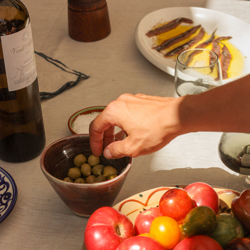 hand olives food table